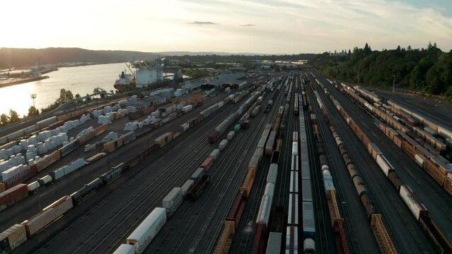 Circling aerial shot over large freight train yard