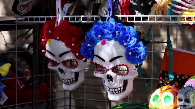 Sugar skull masks for sale at Dia de los Muertos celebration.