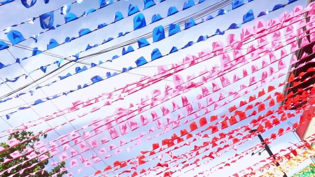 Colorful bunting decorate the street for Fiesta Party. Filmed in the Philippines. 01-09-23