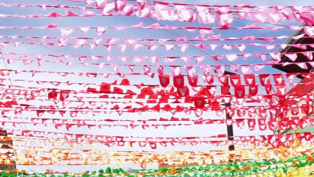 Strings of colorful bunting line the streets of a Philippine city for charter day fiesta party - 01-09-23