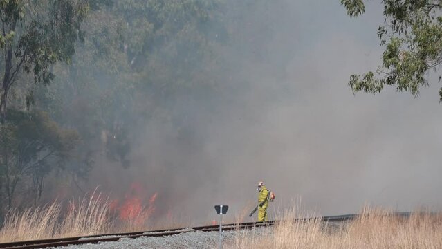 Australian fire fighter fight bushfire in queensland Australia