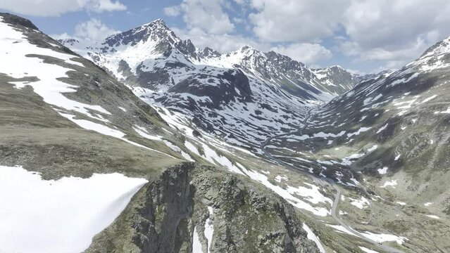 Early summer with remnants of snow on the Flueelapass, Schwarzhorn on the left, drone shot, aerial photo, Flueelapass, Grisons, Switzerland, Europe