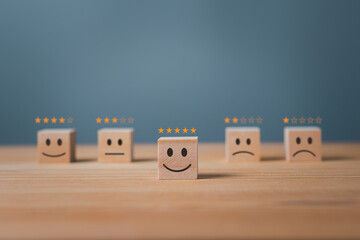 Wooden blocks with icons 1 to 5 stars for service satisfaction. Ratings, feedback and positive...