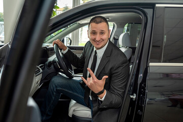 buyer client inside modern car at showroom, concept of sale or rent vechile