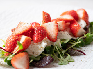 Salad with cheese and fresh strawberries