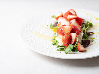 Salad with cheese and fresh strawberries