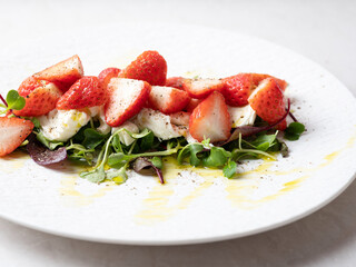 Salad with cheese and fresh strawberries