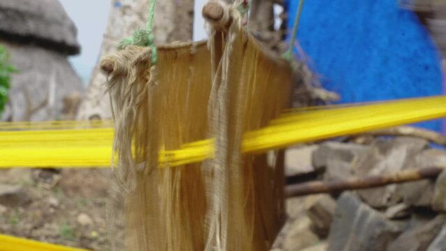 Old Fashioned Wooden Loom Weaving In Konso Town, Omo Valley In Ethiopia. Close Up