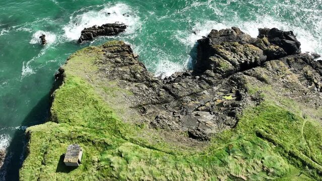 Coast of Ireland remains of old WW2 bunker at the end of a coastal path on The Copper Coast Waterford