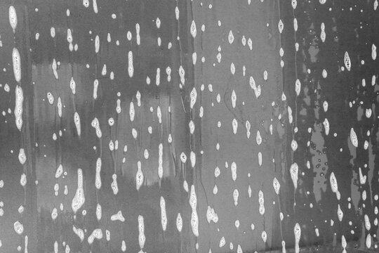 car cleaning and washing with foam soap on the gray car background