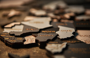 Nigeria and Ghana on wooden map of African continent