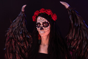 woman look as angel Death with red  roses wreath  closeup