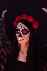 woman look as angel Death with red  roses wreath  closeup