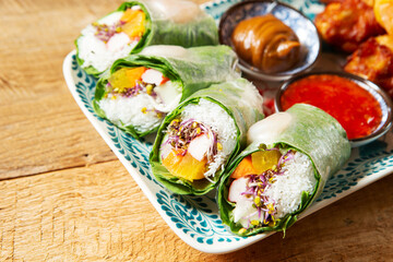 Spring rolls, fried shrimp, and grilled chicken