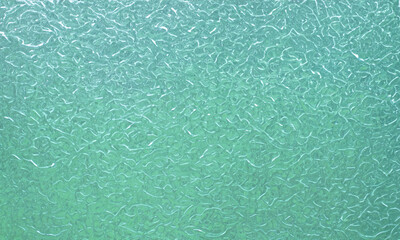 Green glass texture. Natural background.