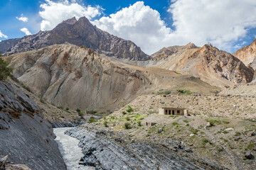 Trekking past an abandoned village along the Tsarab Chu River in Zanskar, Ladakh, India