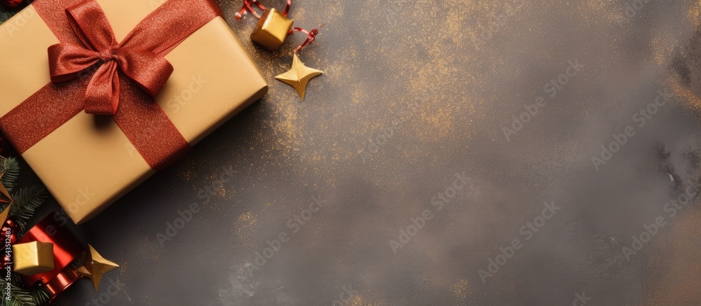 Poster Top view of gift box wrapped in craft paper and tied with colored ribbon on table with copy space