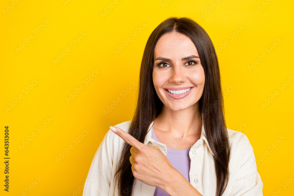 Sticker Photo portrait of lovely young lady point empty space representative agent wear trendy white outfit isolated on yellow color background