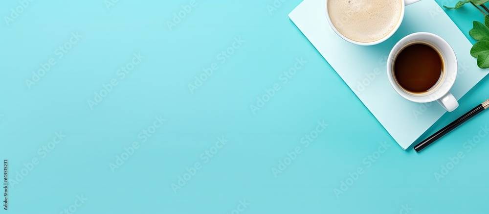 Poster flat lay view of a contemporary office table with a blue color scheme and a cup of coffee allowing f