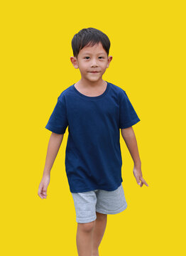 Portrait of Asian little boy looking at camera isolated on yellow background. Image with Clipping path.