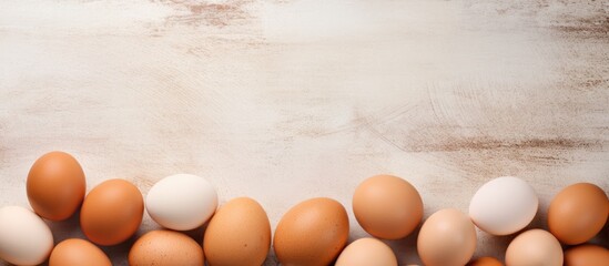 Composite image of brown eggs on a table representing national egg day and healthy eating - Powered by Adobe