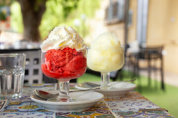 Sicilian granita, Italian summer refreshing dessert made with strawberry and whipped cream, lemon...