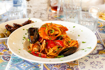 Italian Pasta with seafood Spaghetti allo scoglio, with shrimps, mussels, clams, vongole, tomatoes,...