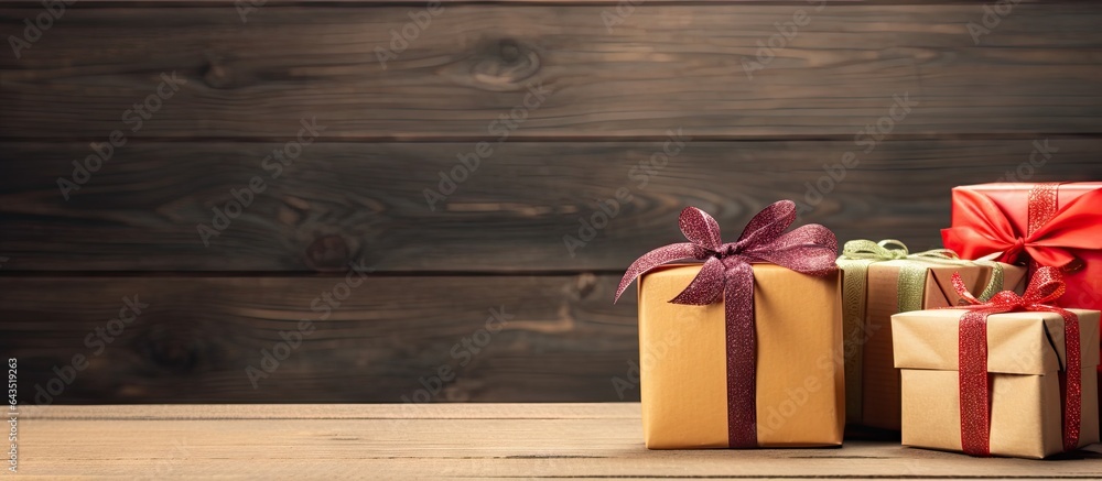 Poster gift boxes in various colors on wooden backdrop adorned with ribbon and straw
