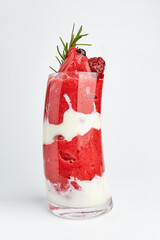 Strawberry Yogurt Smoothie topping with fresh Strawberry, decorated with rosemary isolated on white background. Fruit Smoothies, good drinks for health.