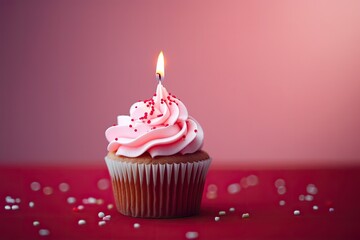 Birthday cake with one candle on pink background. Copy space for text.
