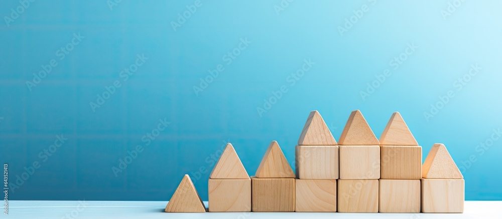 Poster text space available on light blue background with a pyramid of wooden cubes