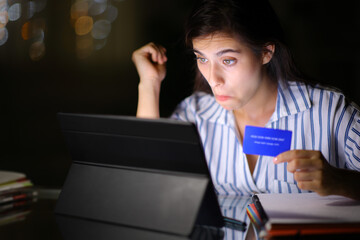 Perplexed student buying online in the night