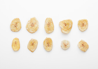 Fototapeta na wymiar Single dried dehydrated banana chips isolated on white background.