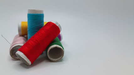 Coils of color threads on a white isolated background