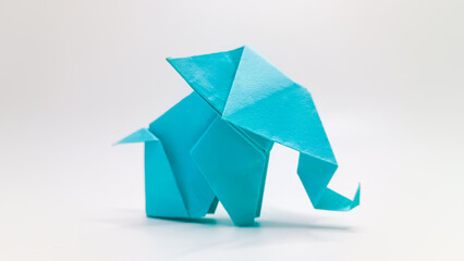 Blue Origami Elephant on an isolated white background