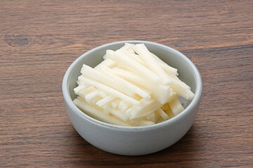 A bowl of fresh jicama or bengkoang (Jicama slices), gut health.
