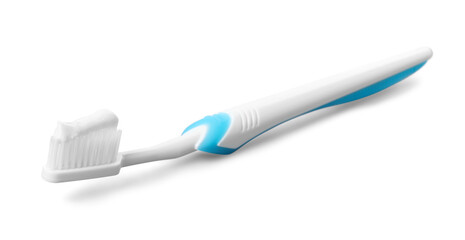 Plastic toothbrush with paste on grey background