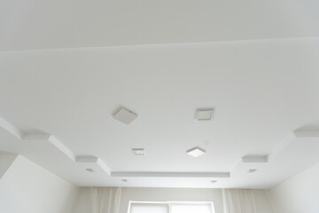 Ceiling LED lamp in the interior. Magnetic track, stylish and modern loft style lamp in the apartment. Premium photo.