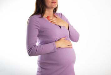 A pregnant girl who has heartburn in her stomach. Reflux of hydrochloric acid into the esophagus....