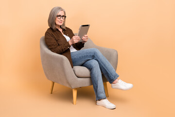 Full body photo of sit comfort chair woman assistant check daily tasks tablet touchscreen useful...