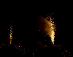 sparks from fireworks on a black background.