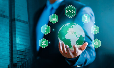 ESG environmental social governance business strategy investing concept. Businessman pressing button on screen. Concept of Environmental social governance esg economy, investment, development..