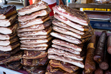 Serbian cured meat and prosciutto assortment on the traditional meat food market Serbia - obrazy, fototapety, plakaty