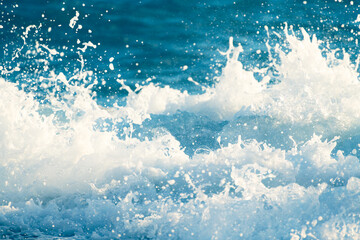 Splash of the sea wave with foam close up. Abstract sea wave background.