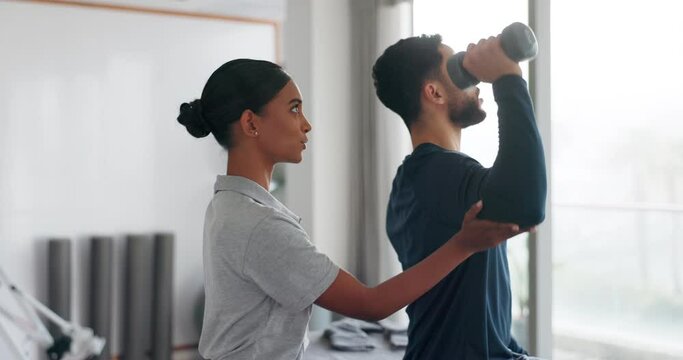 Woman, consulting or dumbbell for patient in physiotherapy, muscle rehabilitation or strength training help. Man, athlete or physiotherapist in sports clinic for physical therapy support with weights