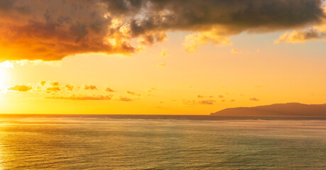 Fototapeta na wymiar scenic landscape of colorful sunset or sunrise above water, evening or morning seascape