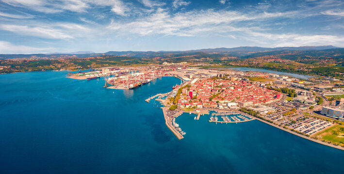 Sunny summer view from flying drone of Koper port. Splendid outdoor scene of Adriatic coastline, Slovenia, Europe. Nice Mediterranean seascape. Traveling concept background.