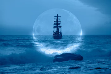 Papier Peint photo autocollant Navire Sailing old ship in a storm sea with crescent moon stormy clouds in the background 