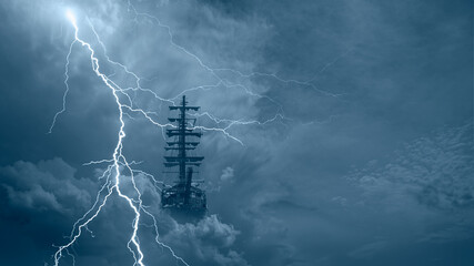Flying old ship in the stormy clouds with thunder and lightning