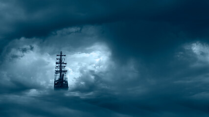 Flying old ship in the stormy clouds 